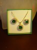 Set placat cu aur de 18k, format din colier si cercei cu cristale smarald princess cut si cristale swarovski clear, bijuterii mireasa