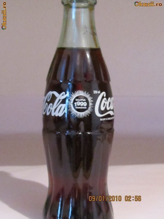 sticla coca-cola din 1999 cu eclipsa foto mare